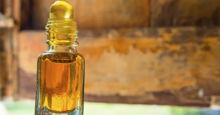 bottle of oil on a wooden table