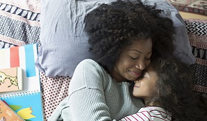 Mother and daughter cuddling