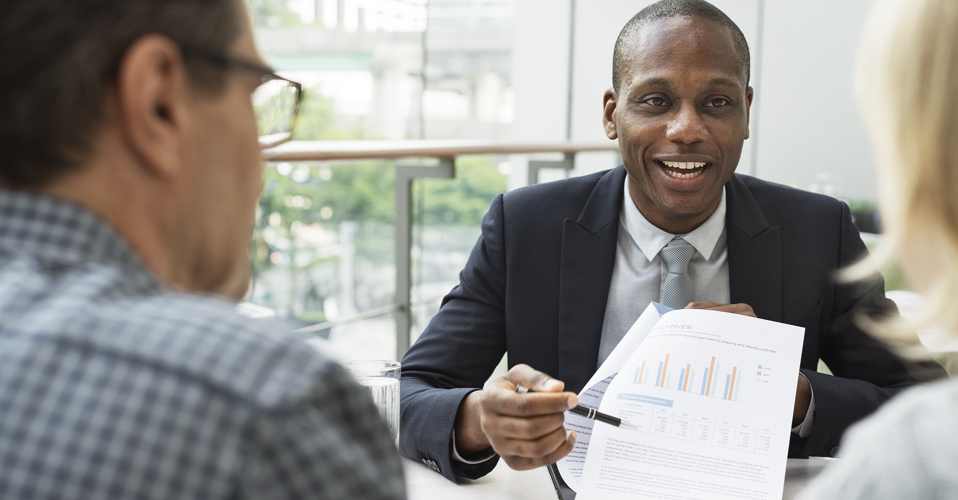 couple sitting and talking to financial planner