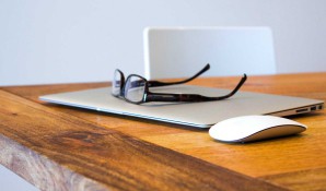 laptop and glasses on desk