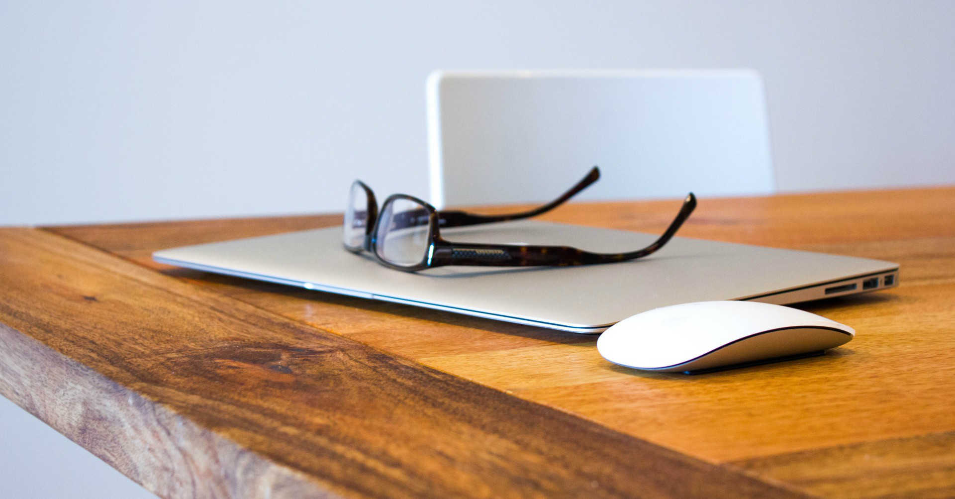 laptop and glasses on desk