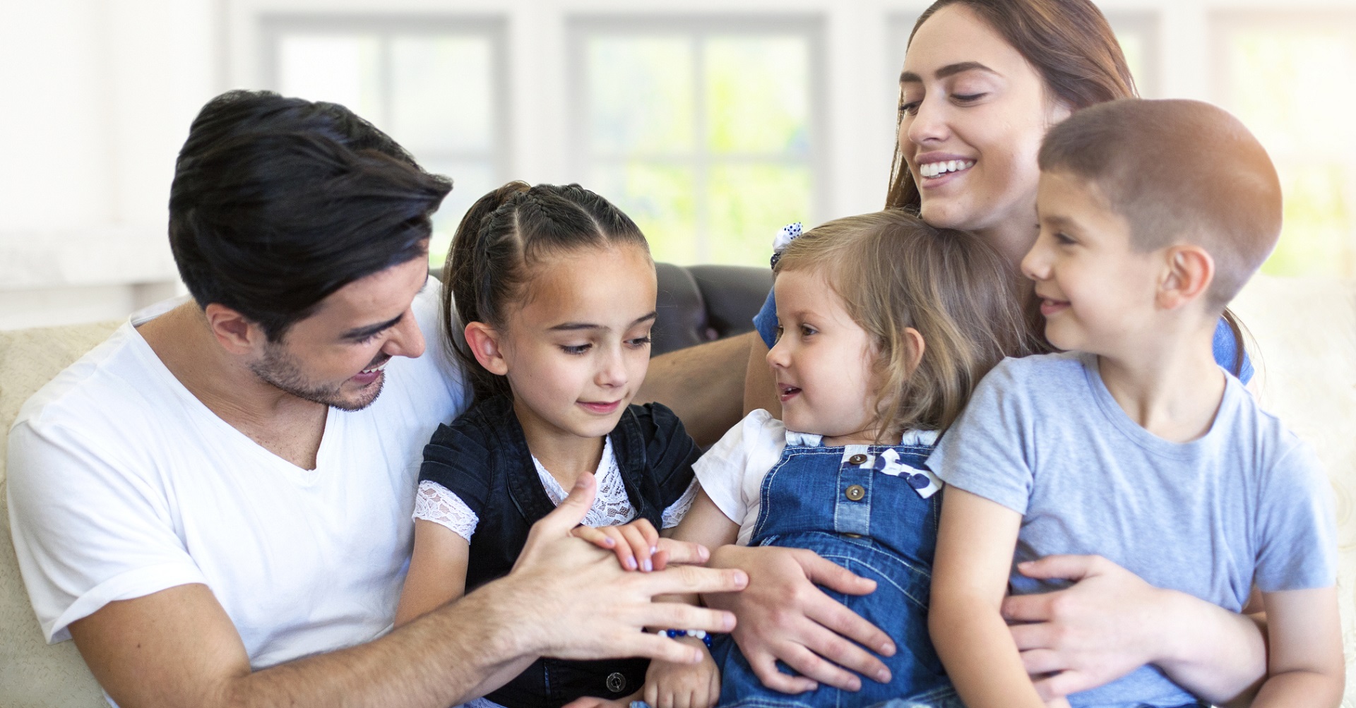 happy family sitting on couch