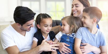 happy family sitting on couch