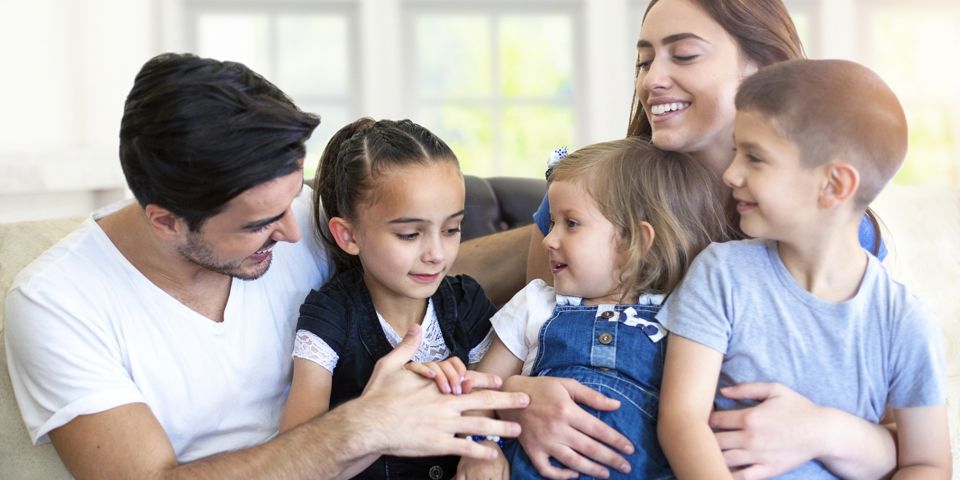 happy family sitting on couch