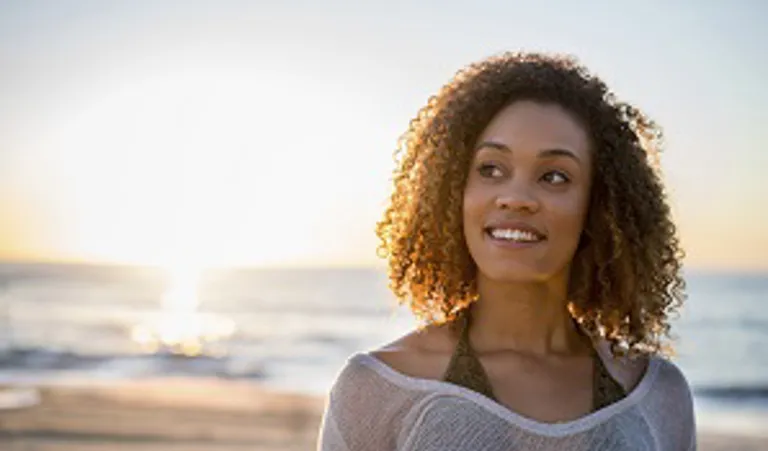 woman on beach thinking
