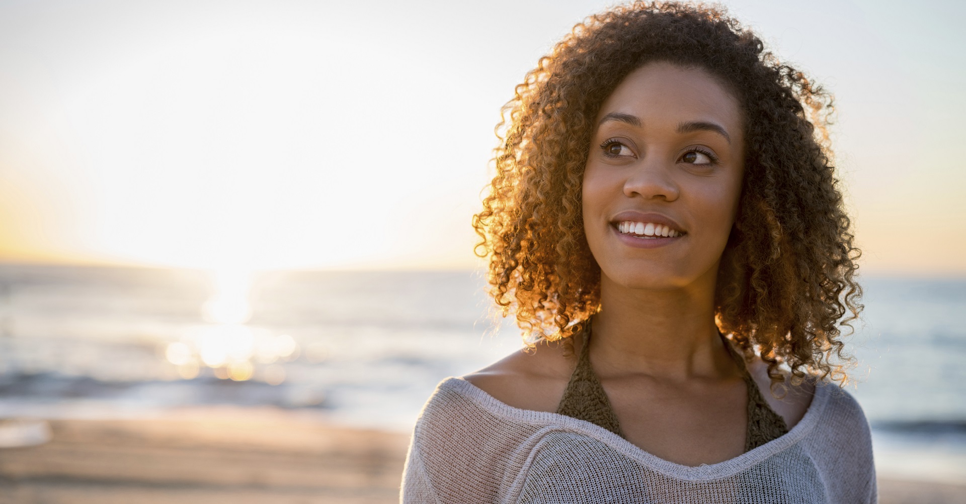 woman on beach thinking