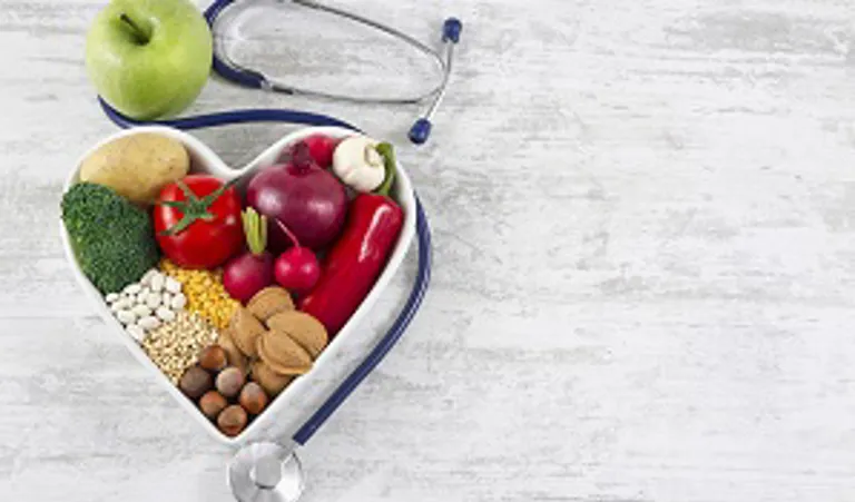Bowl of vegetables in heat shape with stethoscope