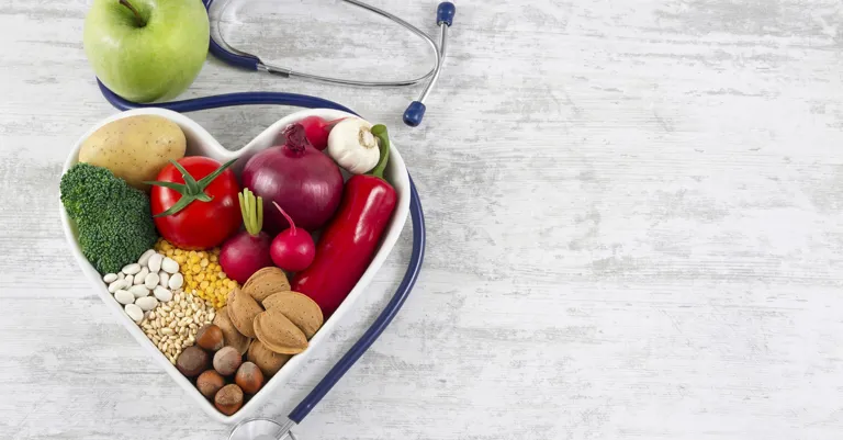 Bowl of vegetables in heat shape with stethoscope