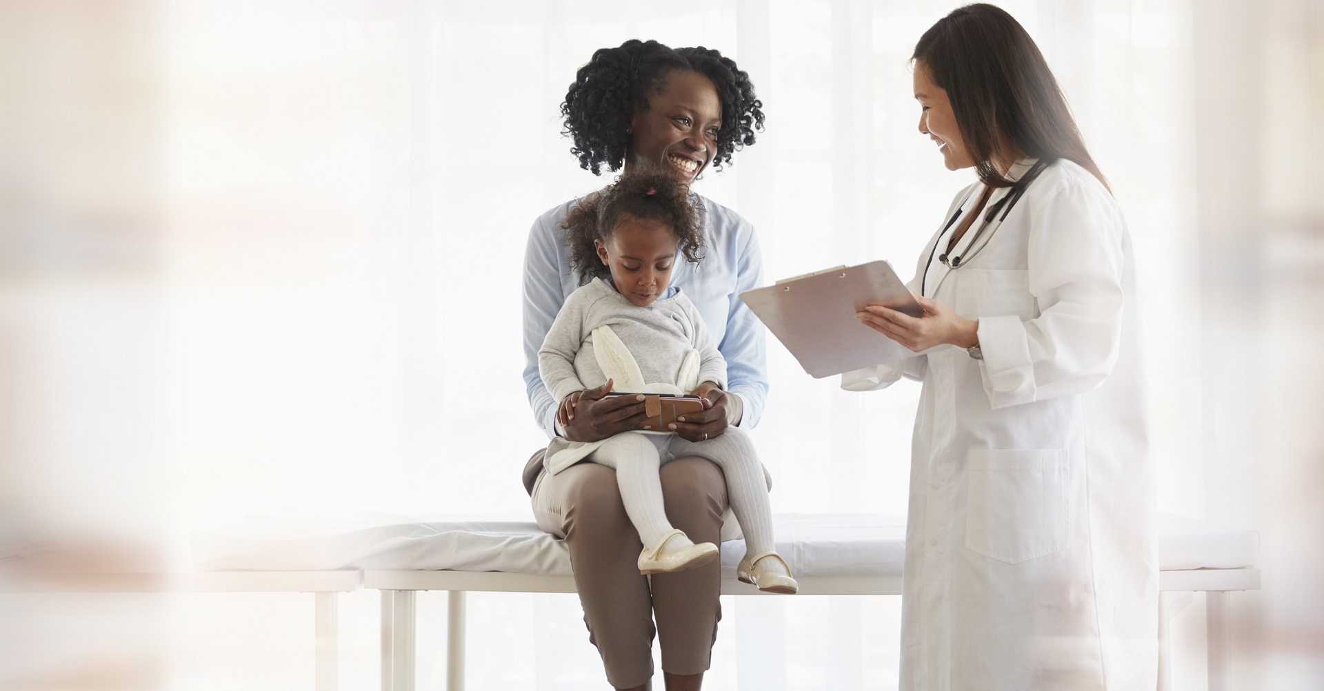 Mother with daughter at doctor