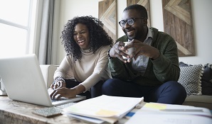 couple at home on laptop together