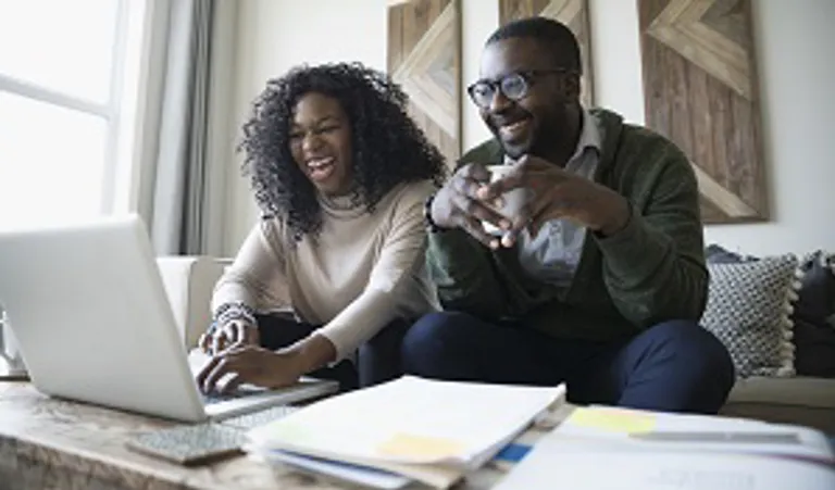 couple at home on laptop together
