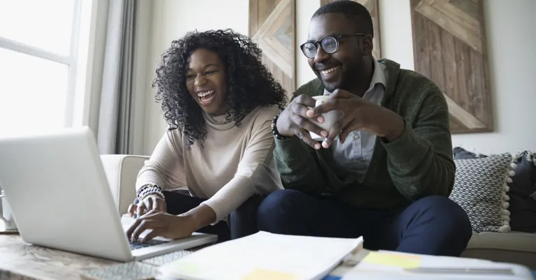 couple at home on laptop together