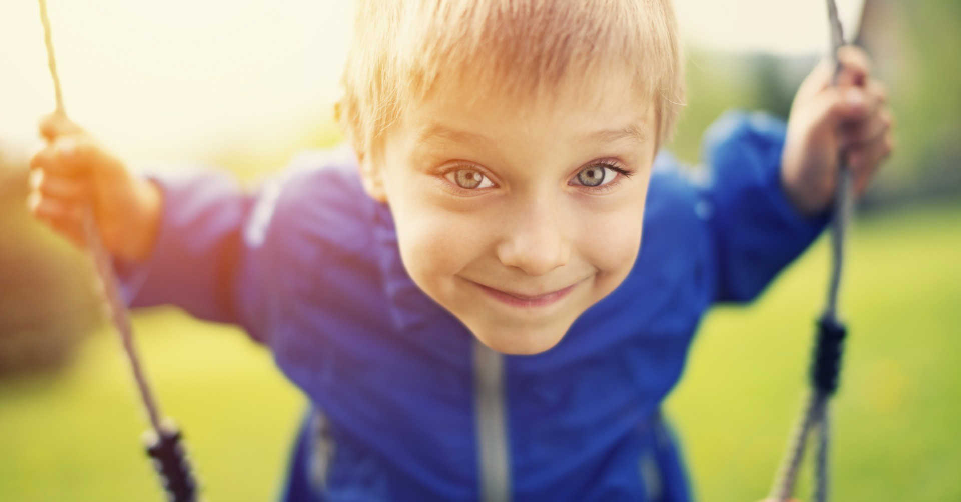 boy on swing in garden