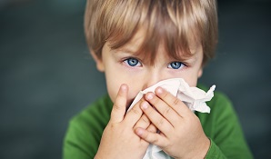 Little kid blowing his nose