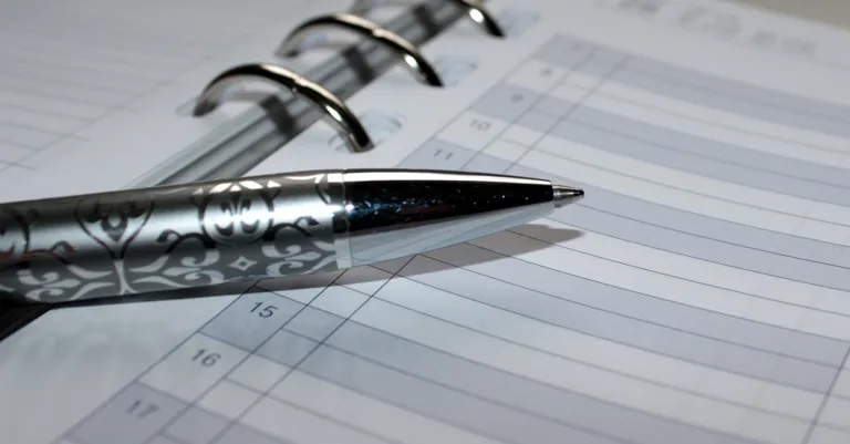 calendar with pen on it