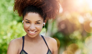 smiling woman about to go for a run