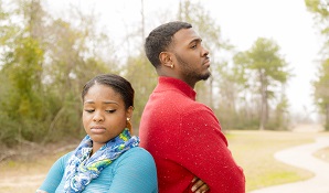 upset couple facing their backs together