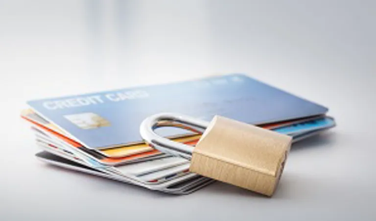 credit cards on table with padlock