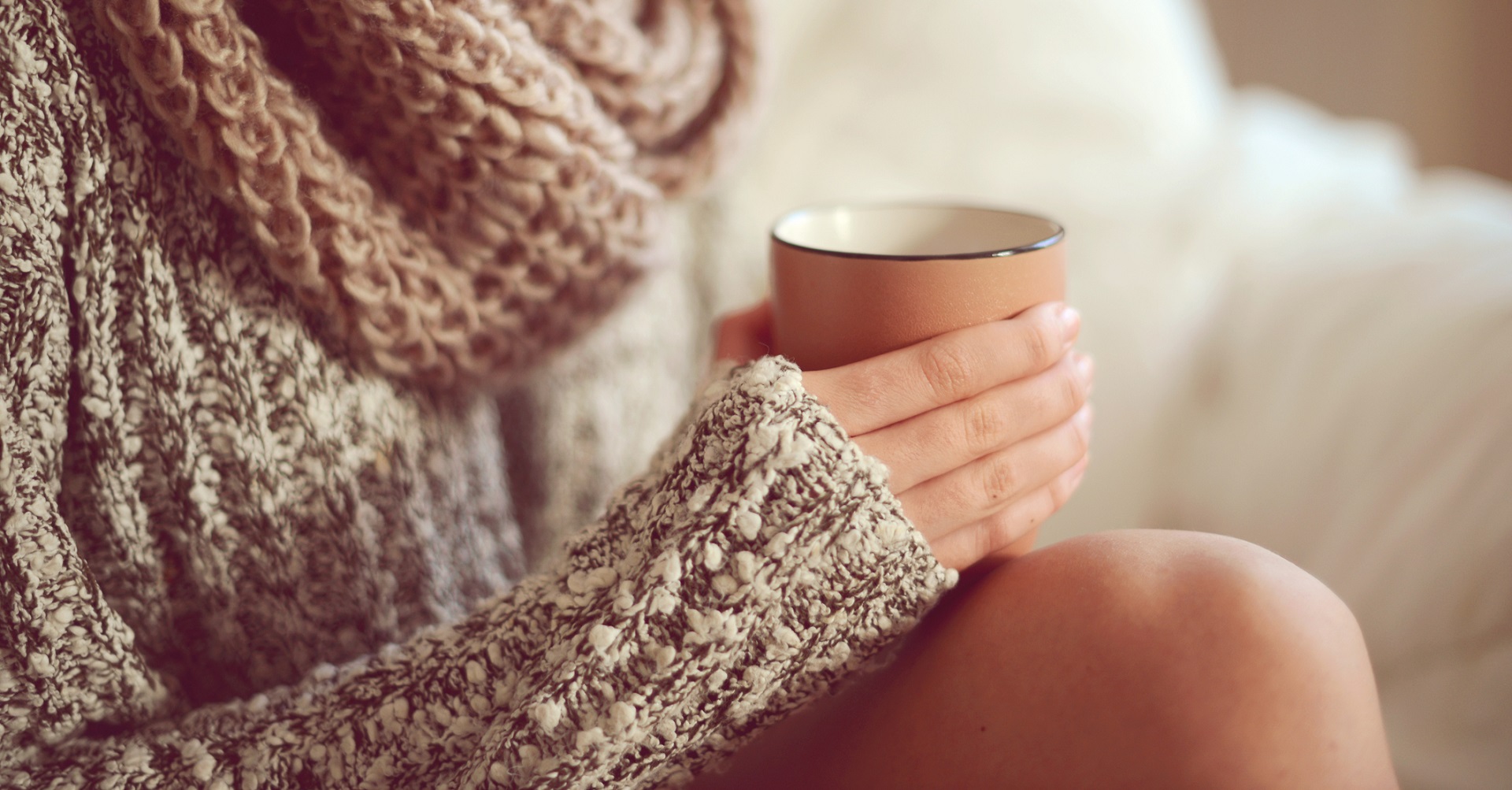 woman sitting with a cup of coffee