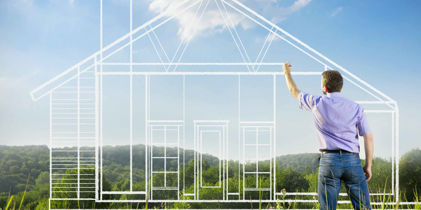 man drawing house in with clouds