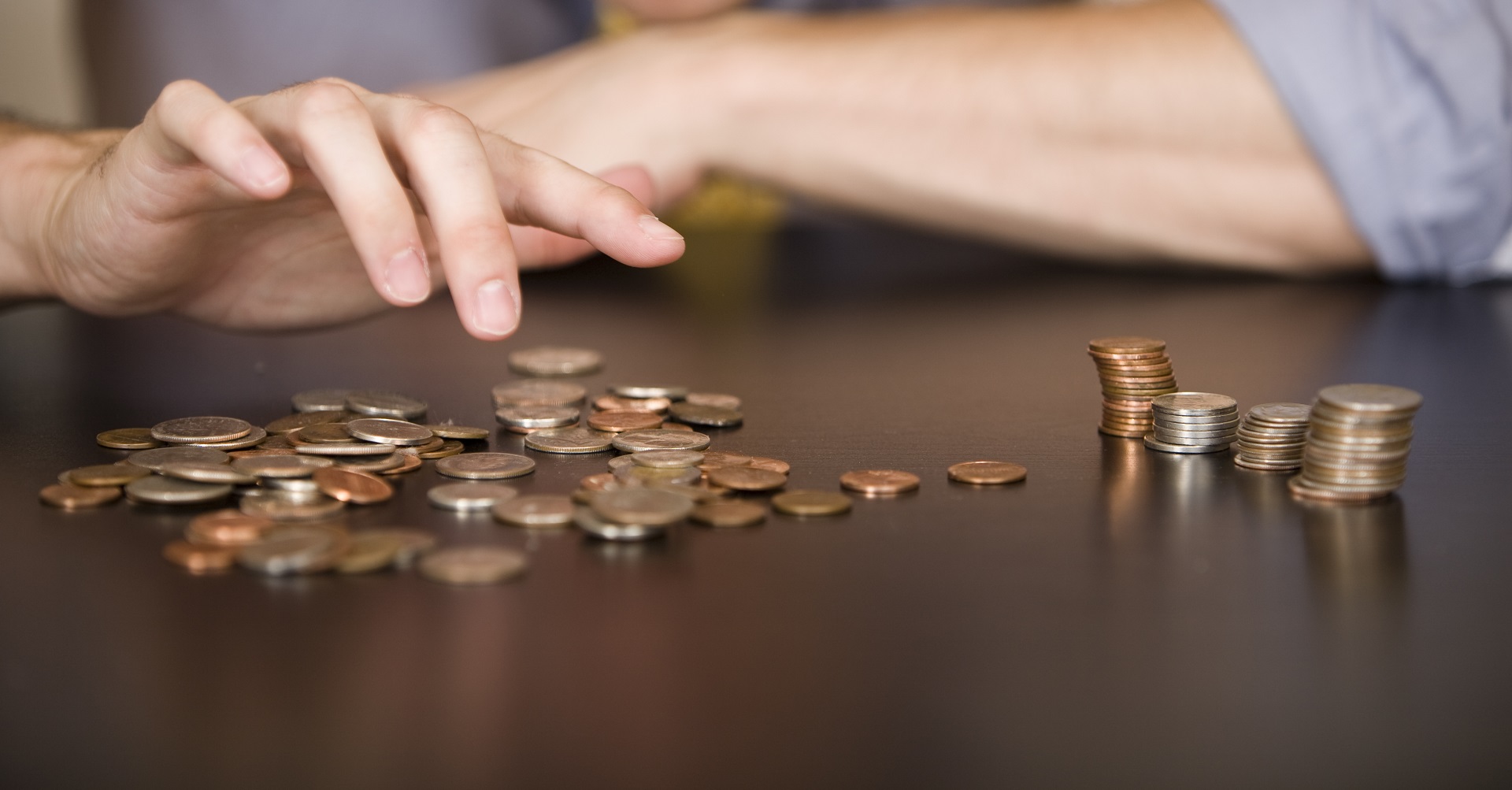 man counting coins