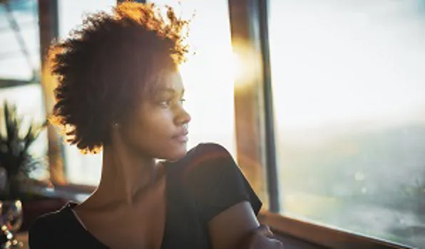 woman looking out window