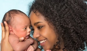 Mother holding new-born baby