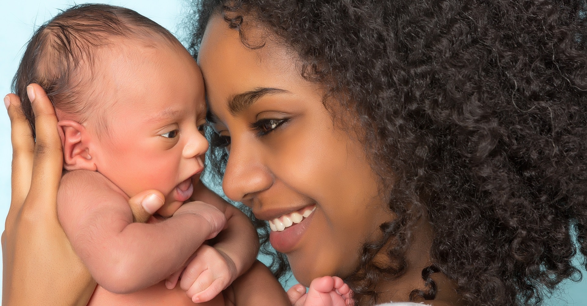 Mother holding new-born baby