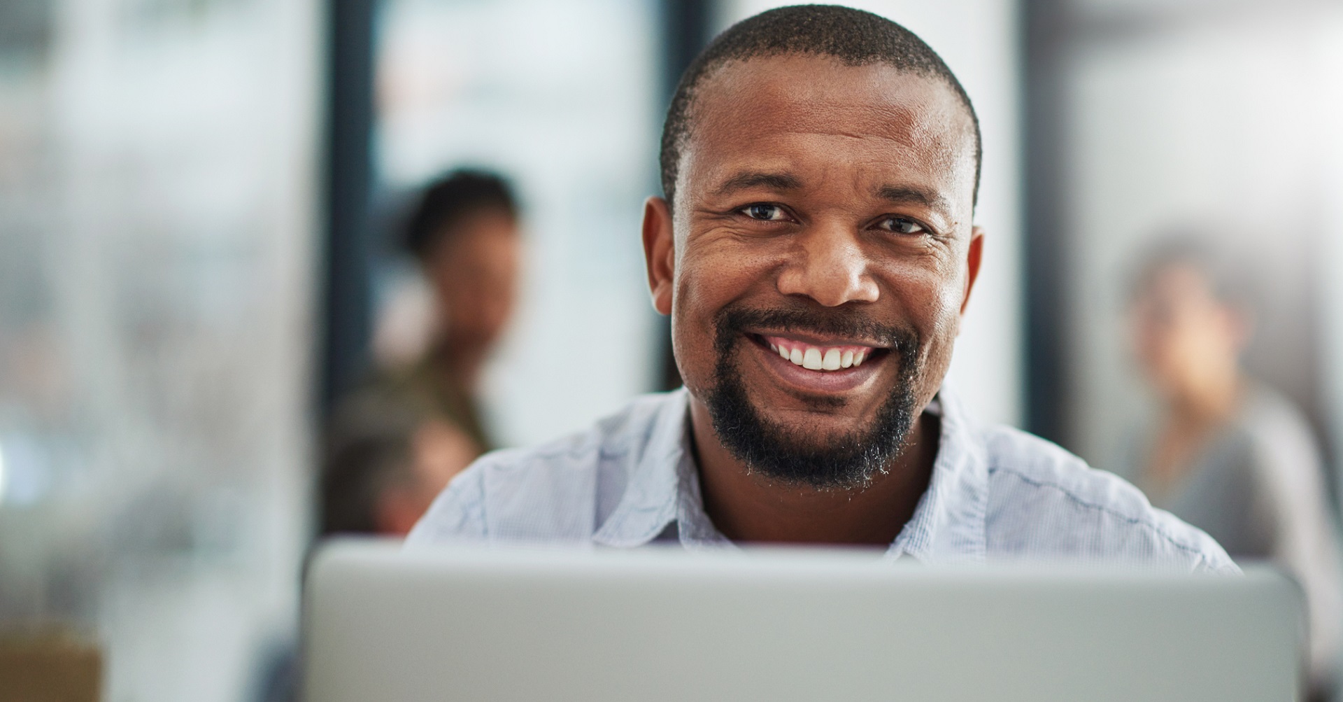 man sitting behind computer