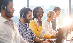 Woman smiling at camera in call centre