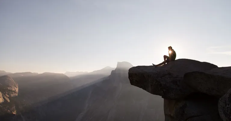 Man sitting on rock