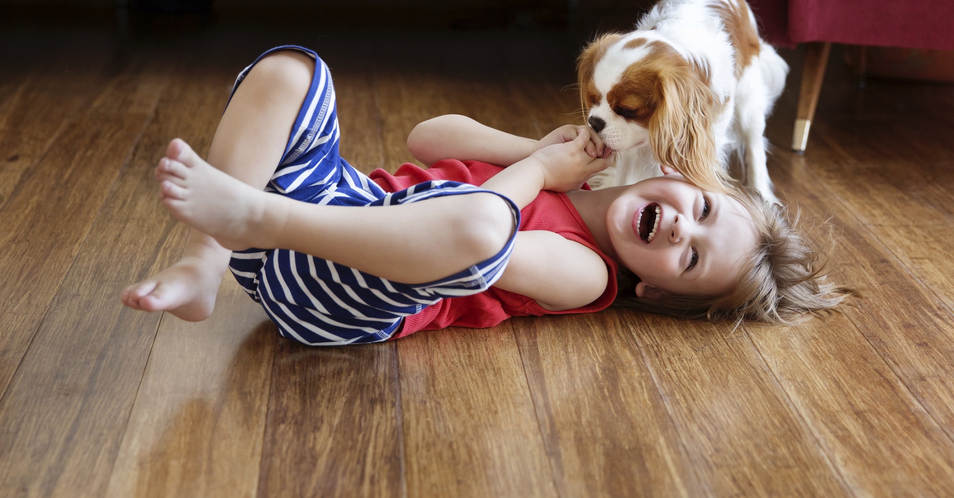 Happy child laying on the floor