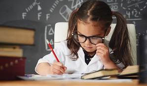 Smart child working at desk