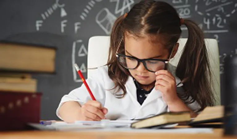 Smart child working at desk