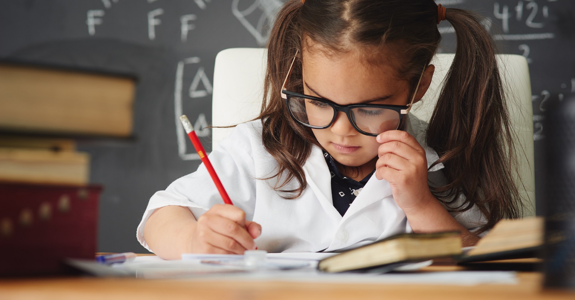 Smart child working at desk