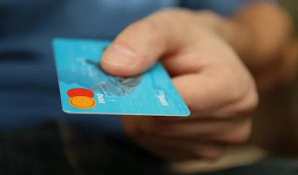 hand holding credit card