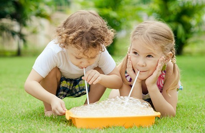 Kids playing with bubbles