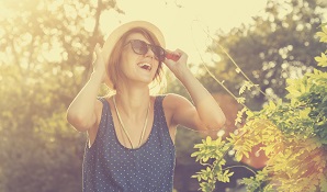 woman with hat smiling