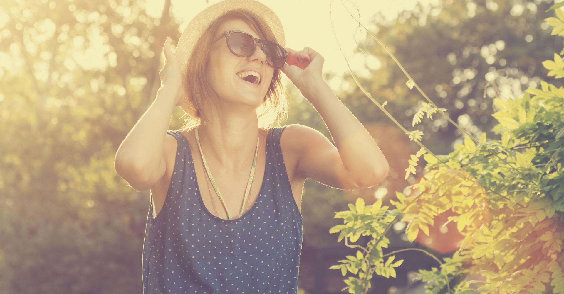 woman with hat smiling