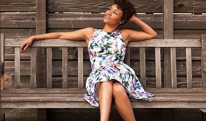 Woman sitting on bench looking youthful