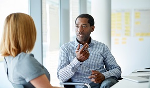 Man meeting with woman in office