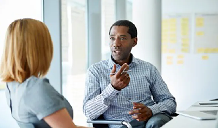 Man meeting with woman in office