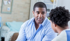 father having conversation with son