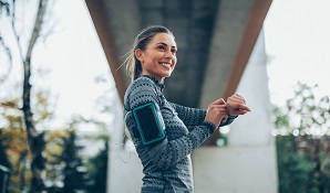 woman running with a smart watch