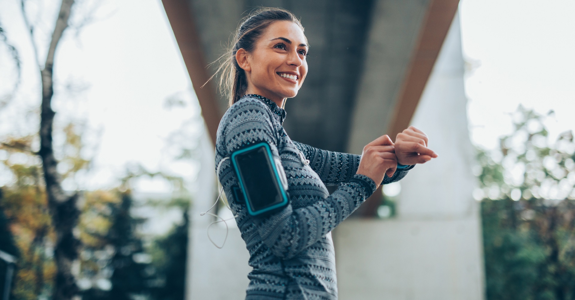 woman running with a smart watch