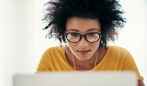 woman sitting on couch thinking