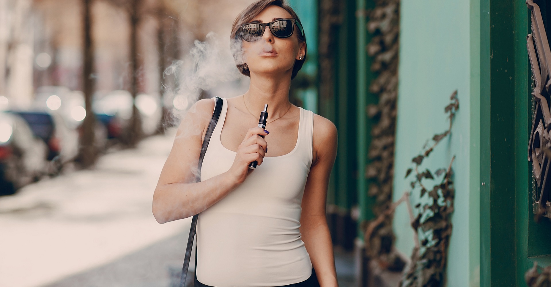 woman smoking e-cigarette