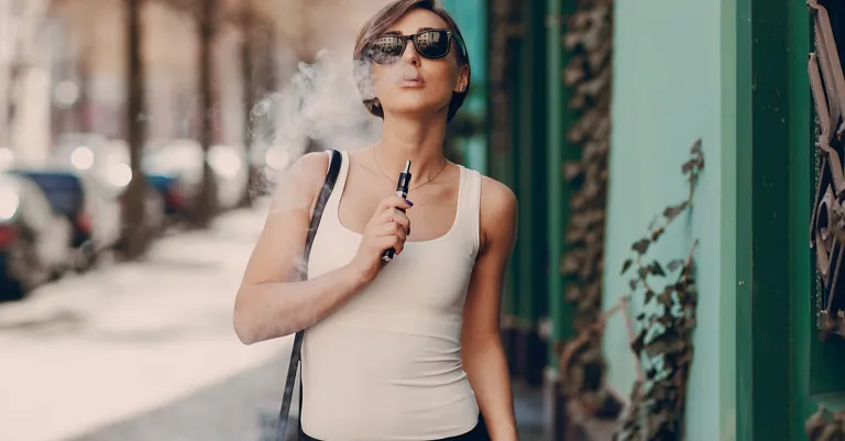 woman smoking e-cigarette