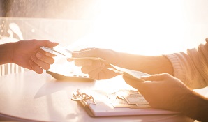 woman handing over money to someone