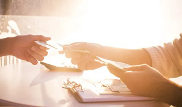 woman handing over money to someone
